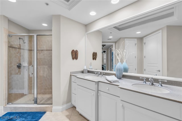 bathroom featuring vanity, a shower with shower door, and tile patterned flooring