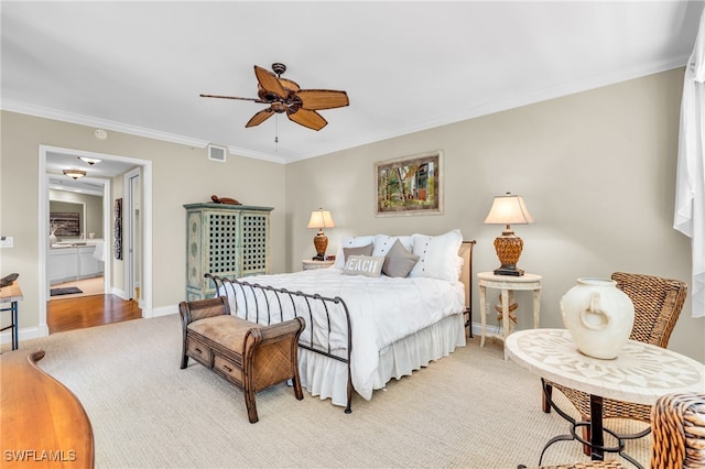 bedroom featuring light carpet, crown molding, and ceiling fan