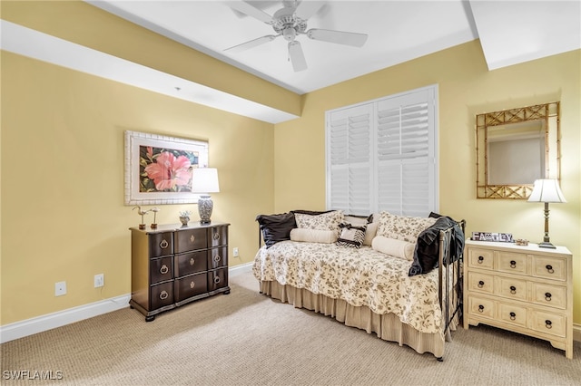 bedroom with ceiling fan and light colored carpet