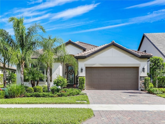 view of front of property with a garage