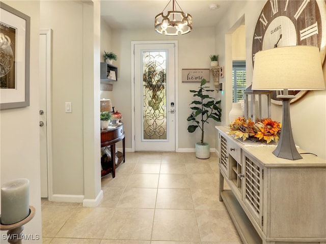 doorway featuring a notable chandelier and light tile patterned floors