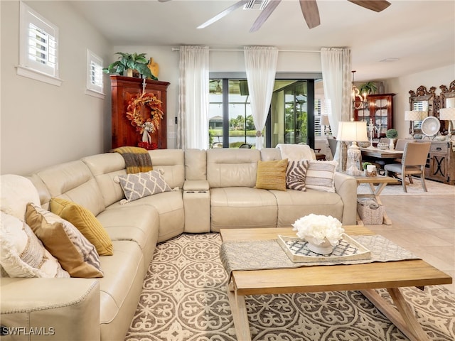 living room featuring ceiling fan and light tile patterned floors