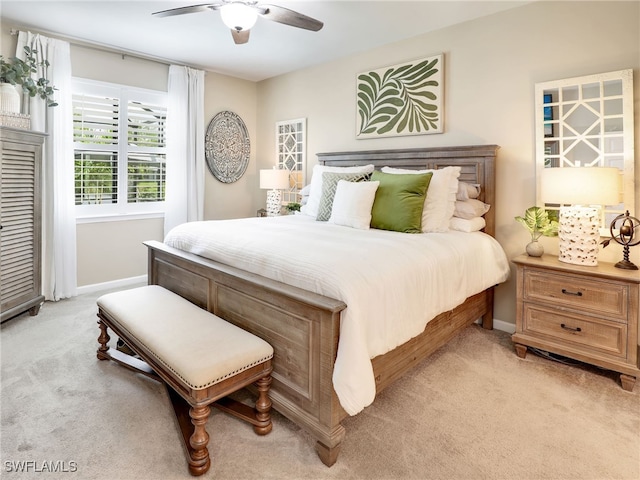 bedroom featuring ceiling fan and light colored carpet