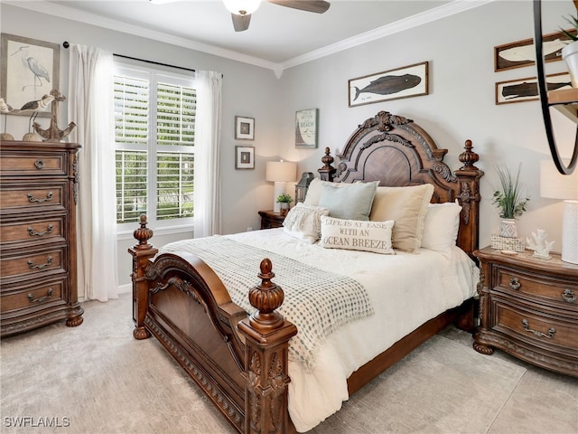 carpeted bedroom with crown molding and ceiling fan