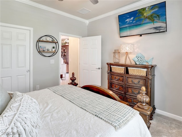 bedroom with carpet floors and ornamental molding