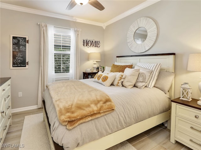 bedroom with ceiling fan, crown molding, and light hardwood / wood-style floors