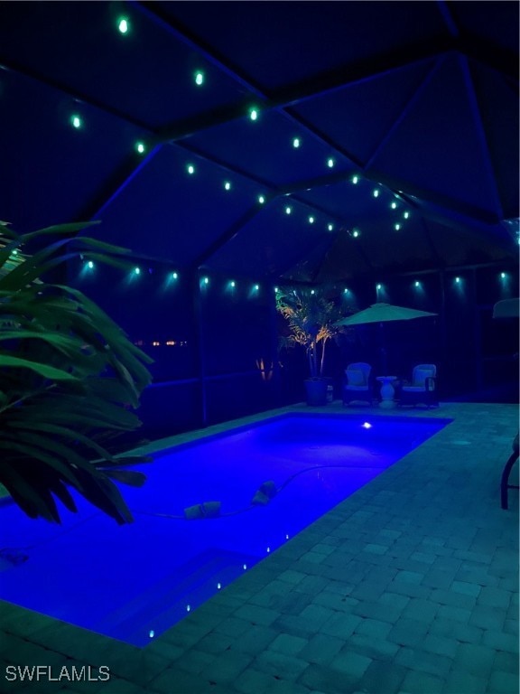 view of pool at night