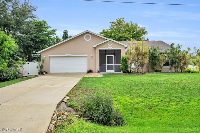 single story home with a garage and a front lawn