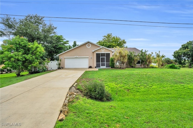 view of front of house with a garage and a front yard