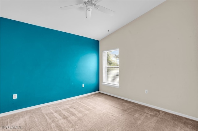 unfurnished room featuring carpet flooring, ceiling fan, and vaulted ceiling