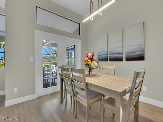 dining space with light wood-type flooring