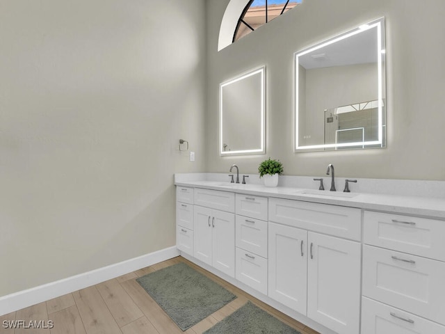 bathroom featuring vanity and hardwood / wood-style flooring