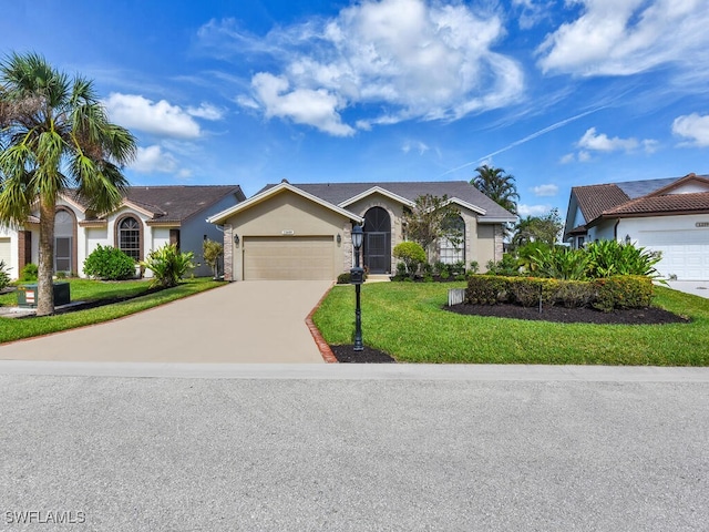 ranch-style house featuring a front yard and a garage