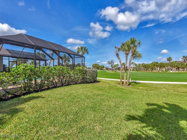 view of yard with a lanai