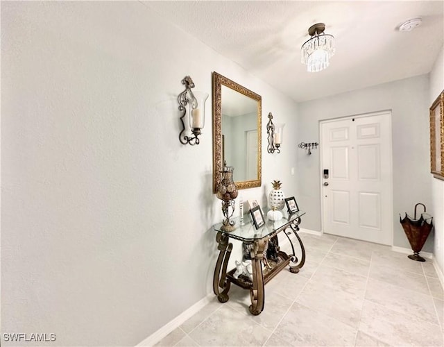 3214 68th St W, Lehigh Acres, FL 33971 - foyer entrance featuring light tile patterned flooring and baseboards