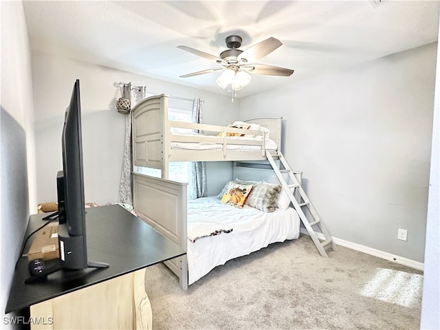 bedroom with carpet floors, baseboards, and a ceiling fan