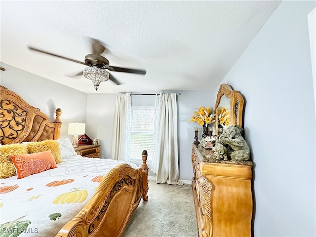 bedroom with light carpet, ceiling fan, a textured ceiling, and baseboards