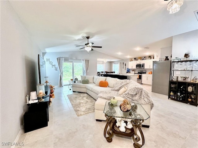3214 68th St W, Lehigh Acres, FL 33971 - living room with vaulted ceiling, a ceiling fan, and light tile patterned floors