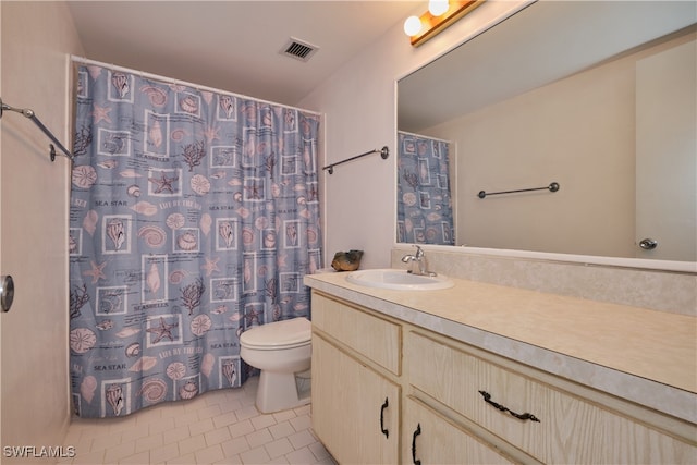 bathroom featuring vanity, toilet, a shower with shower curtain, and tile patterned floors