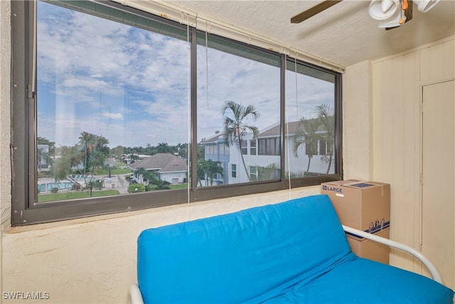 interior space featuring ceiling fan