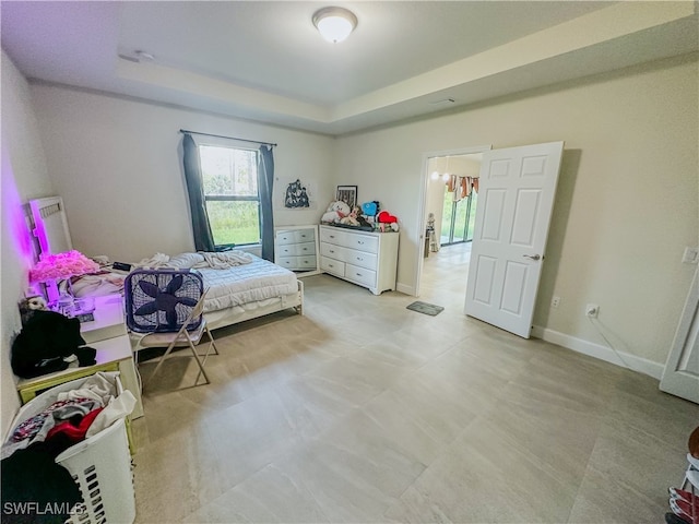 bedroom featuring a raised ceiling