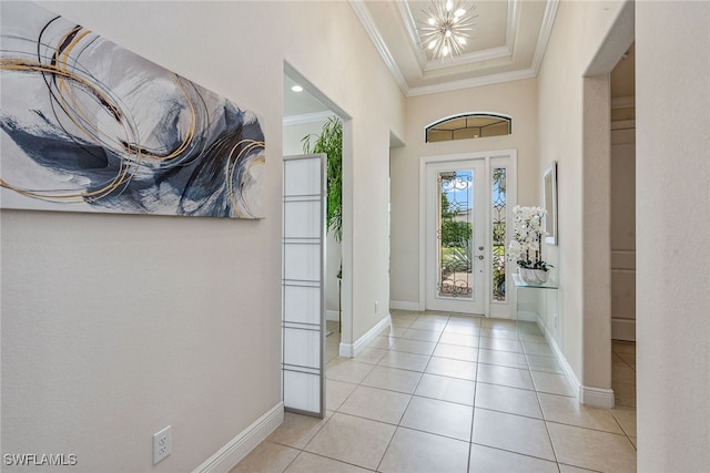 entryway featuring light tile patterned floors and ornamental molding