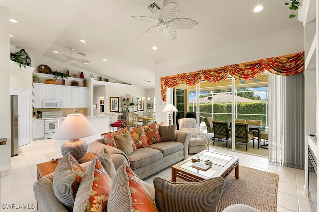 tiled living room featuring ceiling fan with notable chandelier and vaulted ceiling