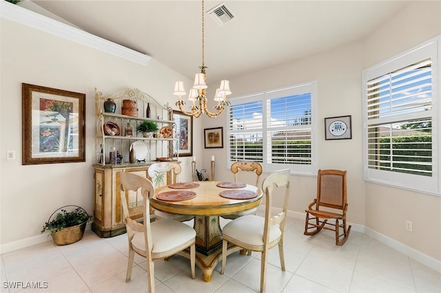 tiled dining room featuring an inviting chandelier, a wealth of natural light, and vaulted ceiling