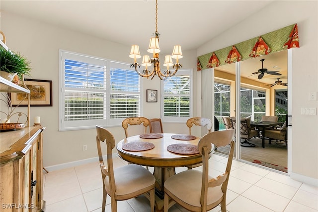 tiled dining room with ceiling fan with notable chandelier