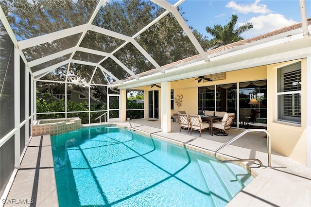 view of swimming pool featuring a lanai and a patio area