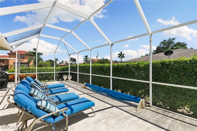 view of patio / terrace with a lanai