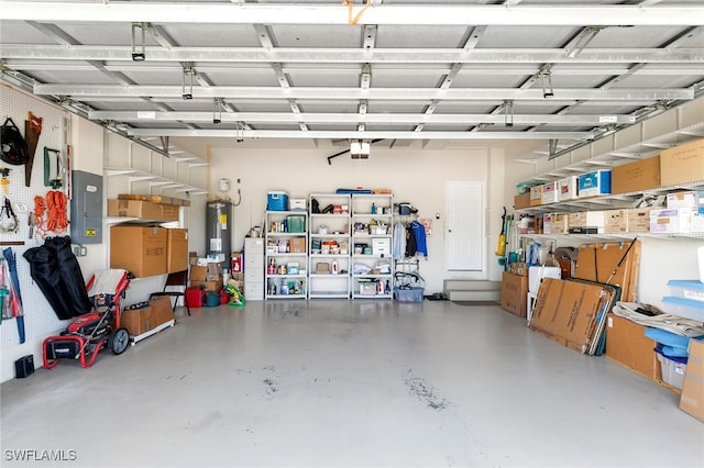 garage with water heater, electric panel, and a garage door opener