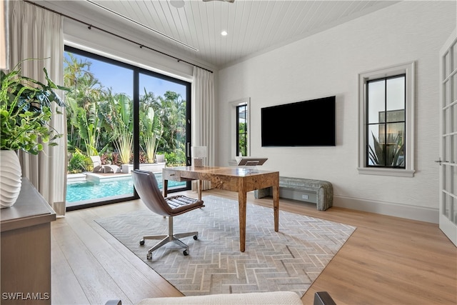 office with wood ceiling and light hardwood / wood-style floors