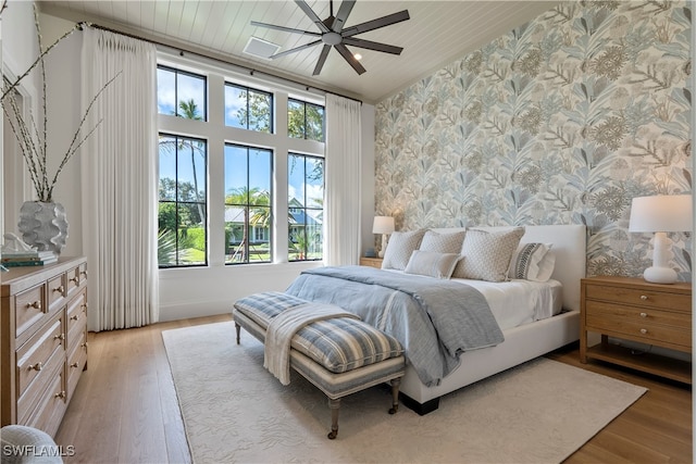 bedroom with ceiling fan and light wood-type flooring