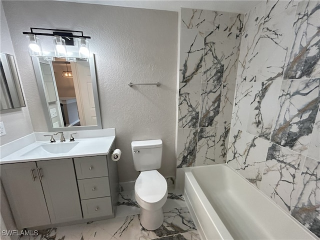 full bathroom featuring washtub / shower combination, toilet, and vanity