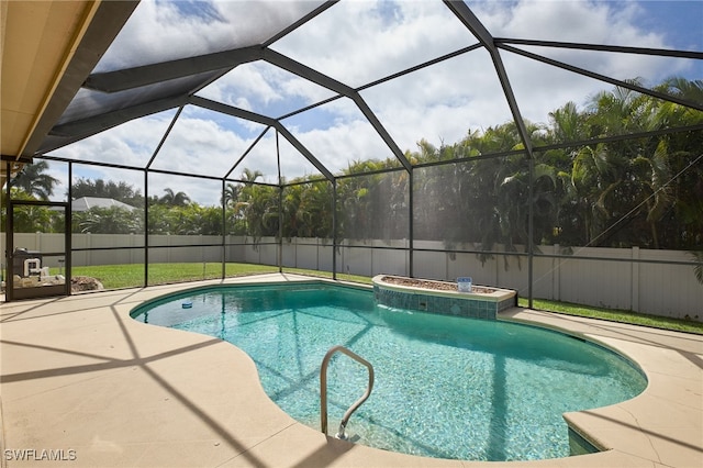 view of pool with a jacuzzi, a lanai, and a patio area