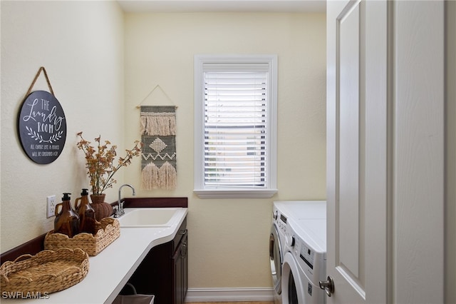 bathroom with vanity and washing machine and dryer