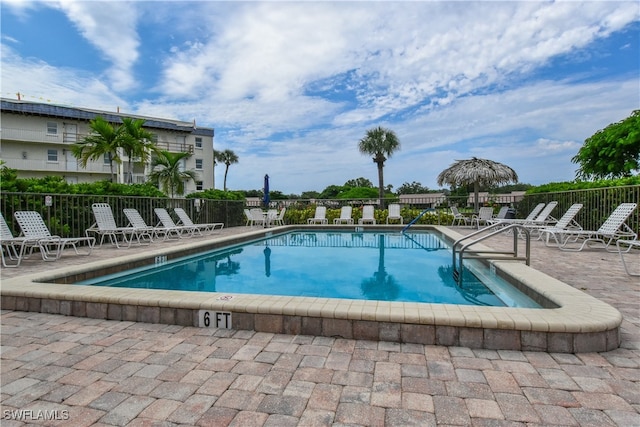 view of swimming pool with a patio area