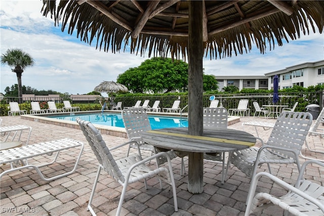 view of swimming pool featuring a gazebo and a patio area