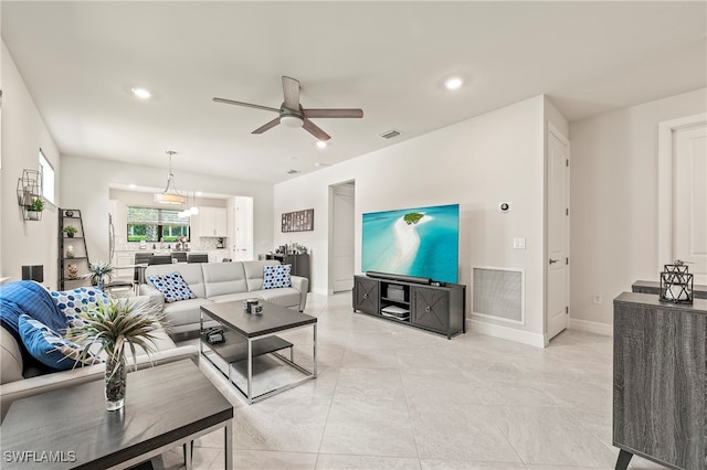 living room featuring ceiling fan