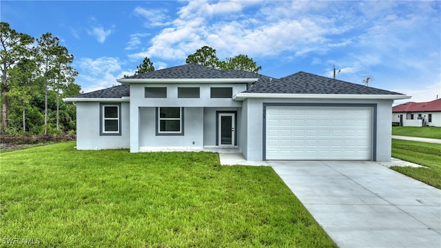 view of front facade with a garage and a front yard