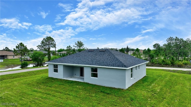 view of side of property with a lawn