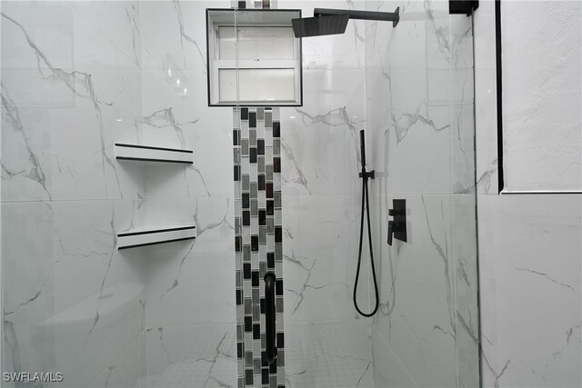 bathroom featuring an enclosed shower