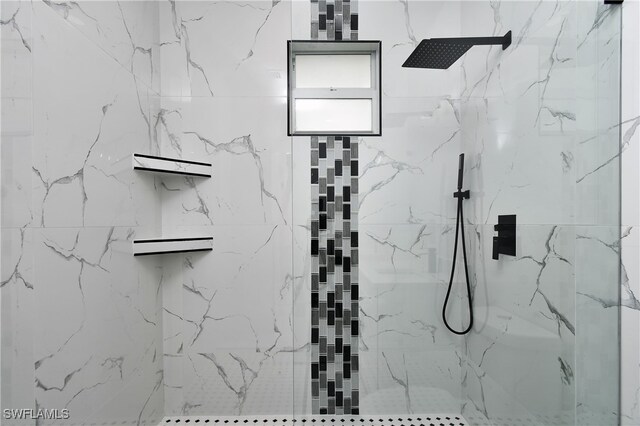 bathroom with tiled shower