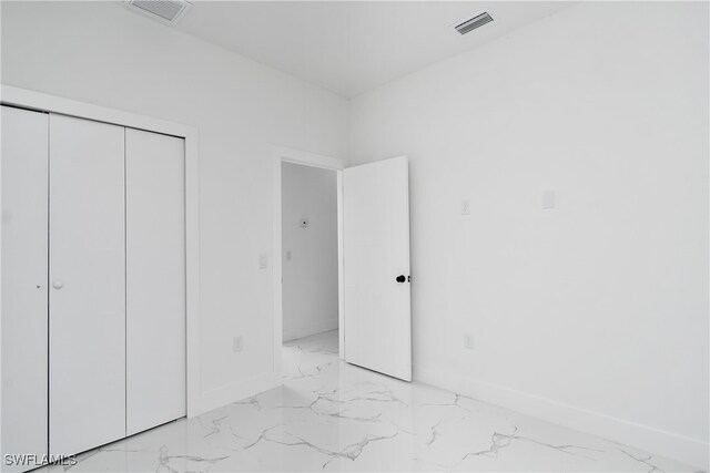 unfurnished bedroom with a closet