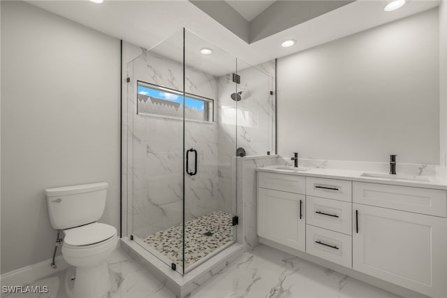 bathroom with vanity, toilet, and an enclosed shower