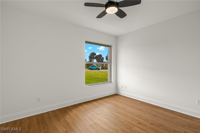 spare room with ceiling fan and light hardwood / wood-style floors