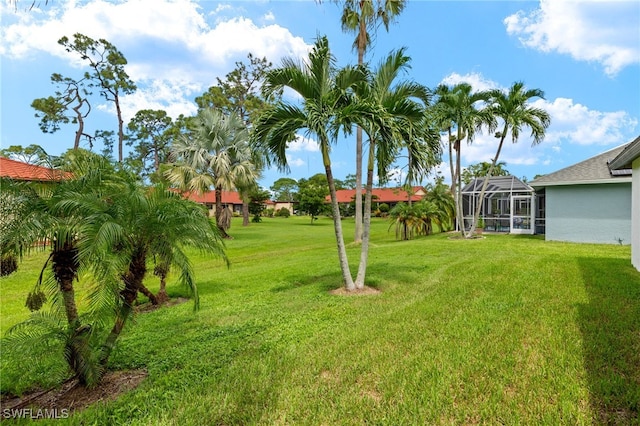 view of yard with a lanai