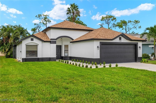 view of front facade featuring a garage and a front lawn