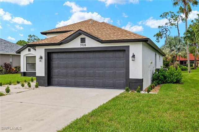 view of front facade with a front yard and a garage